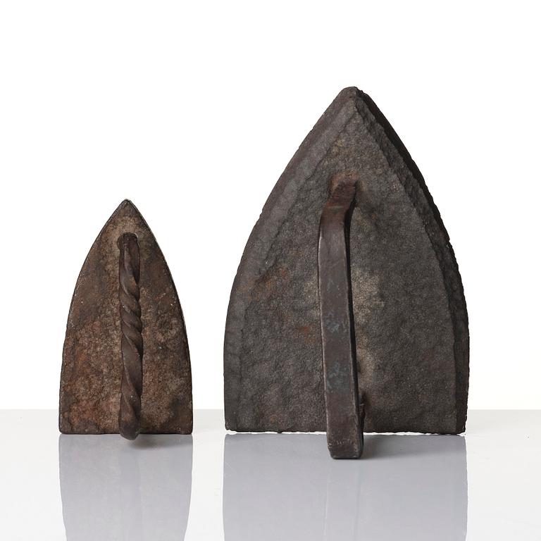 Two cast iron clothes irons, 18th / early 19th century.