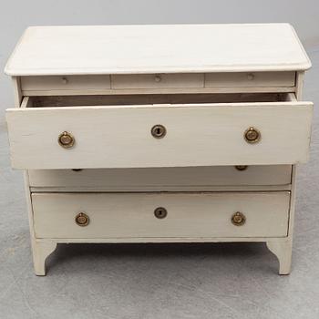 A mid 19th century painted chest of drawers.