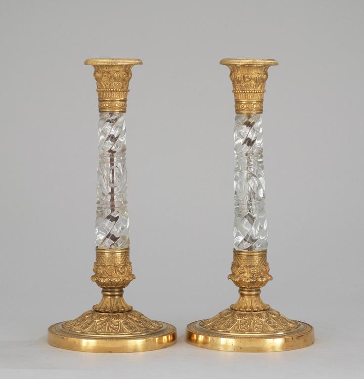 A pair of Russian circa 1830 gilt bronze and glas candlesticks.