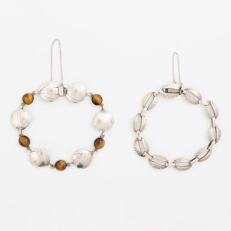 Victor Janson, two silver bracelets, one set with tiger's eye.