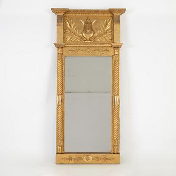 An Empire mirror, first half of the 19th Century.