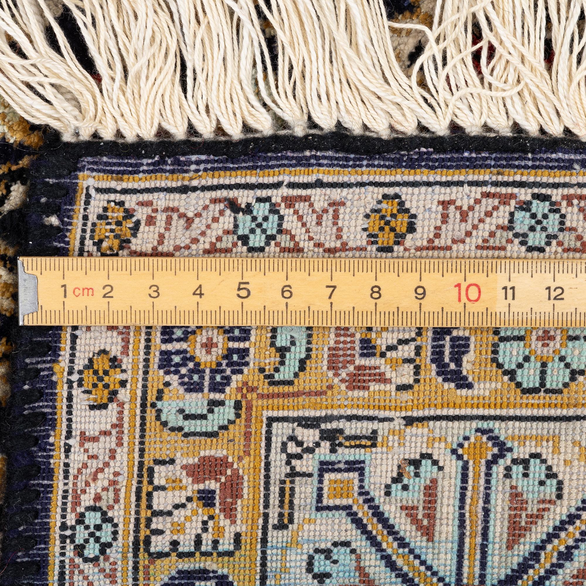A Ghom, silk rug, c. 162 x 102 cm.