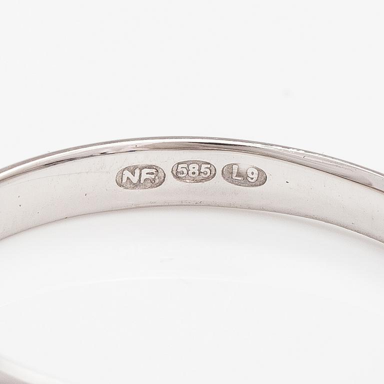 A 14K white gold ring with sapphires.