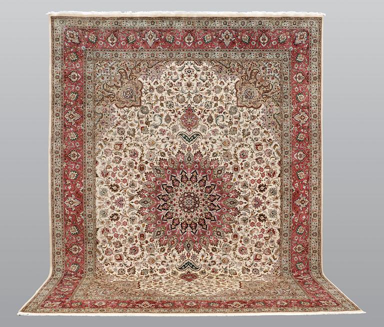 A carpet, Tabriz part silk, so called 50 Raj, cm 400 x 300 cm.