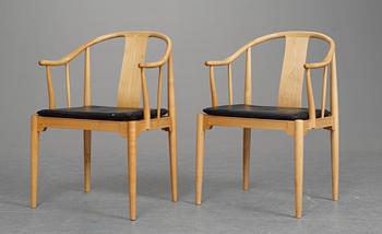 A pair of Hans J Wegner cherrywood "China chairs, Fritz Hansen, Denmark 1987 and 1988.