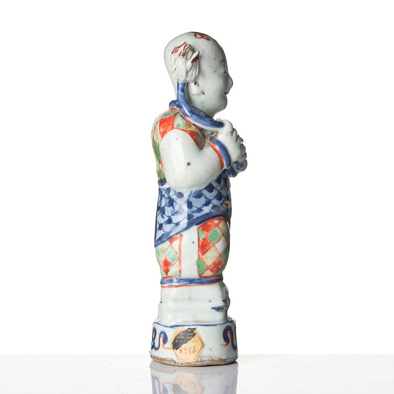 Three Chinese famille verte figures of laughing boys 'Hehe Erxian', 18th century.