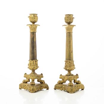 A pair of brass and bronze late Empire candle sticks, mid 20th century.