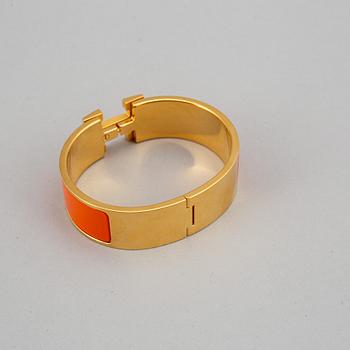 HERMÈS, a 'Clic H' bangle.