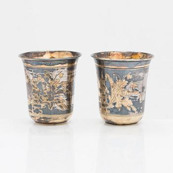 Four parcel-gilt silver beakers, Moscow 1870, 1876 and 1890.