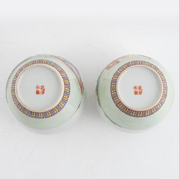 A pair of Chinese famille rose porcelain jars with covers, 20th century.