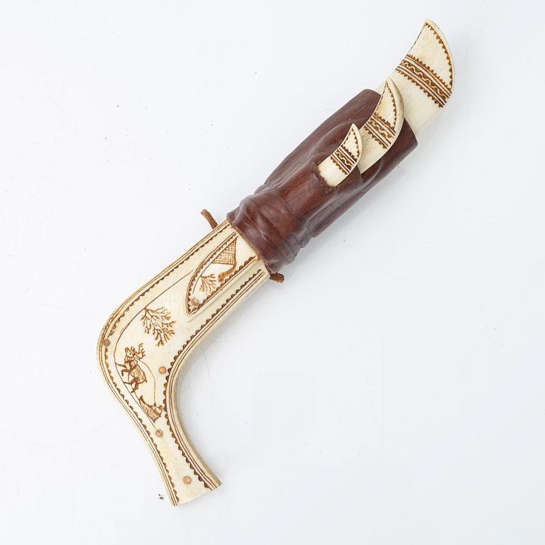 Half-horn knives, cup, bottle, needle case.