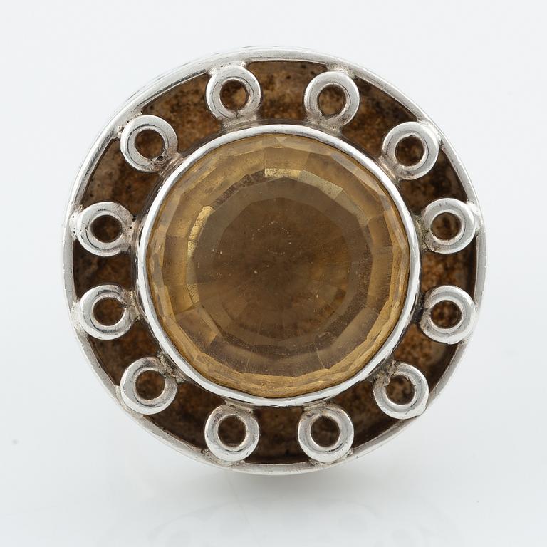 Silver ring with gold stone, signed Ulla Holm.