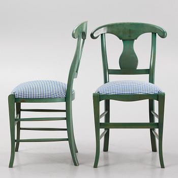 A dining table with eight chairs, Grange, France, late 20th century.