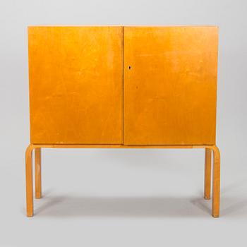 Alvar Aalto, mid-20th century '810' cabinet and a 
'69'chair Oy Huonekalu- ja Rakennustyötehdas Ab.