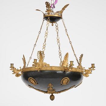 A presumably Russian Empire gilt and patinated bronze nine-branch chandelier, 19th century.