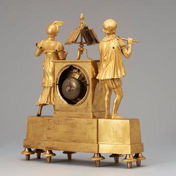 A French "Style troubadour" 19th century gilt bronze mantel clock.