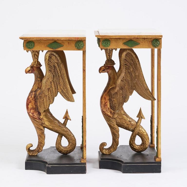 A pair of giltwood console tables, Empire-style incorporating older elements.