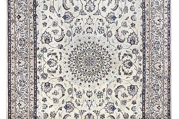 A Nain carpet, part silk, c. 294 x 193 cm.