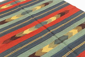 A persian kilim,  ca 242 x 181 cm.