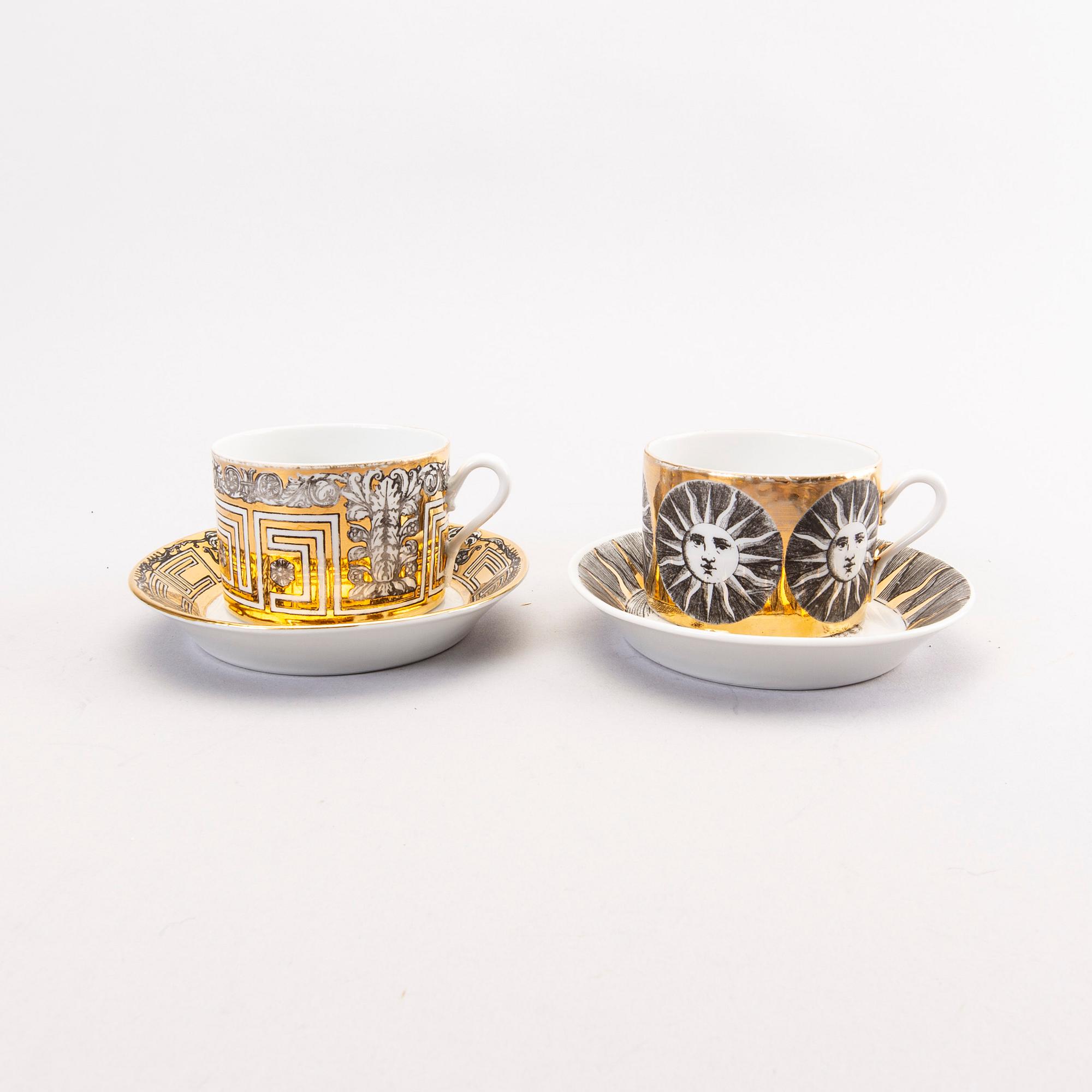 Piero Fornasetti a set of four coffee cups with saucers and two ashtrays.