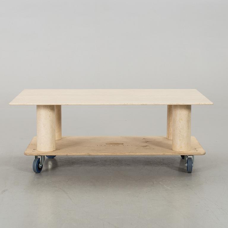 A TRAVERTINE SOFA TABLE.