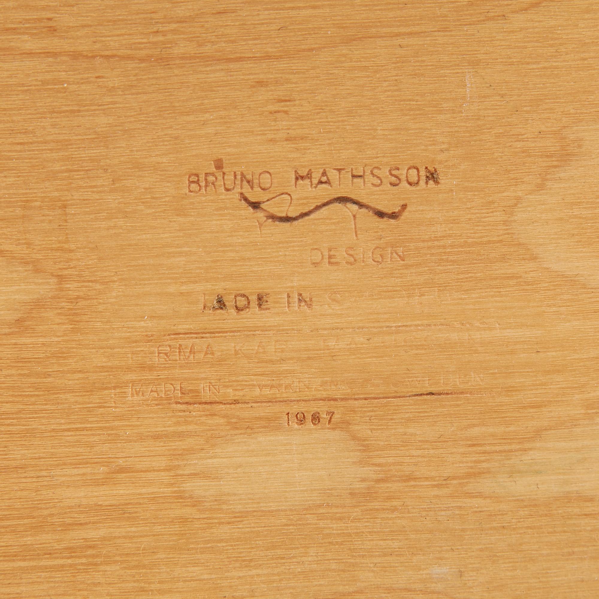 A model T 709 book stand by Bruno Mathsson for Firma Karl Mathsson, dated 1967.