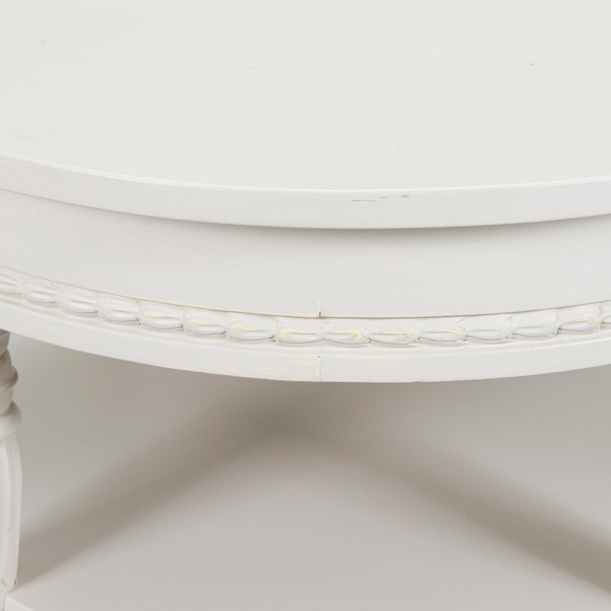 A Gustavian style small round table from first half of the 20th century.
