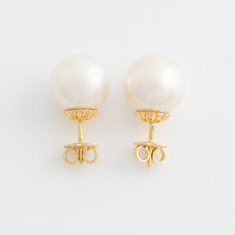 Earrings with cultured South Sea pearls.