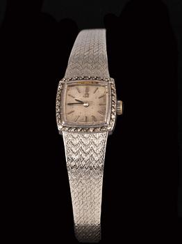 DAMARMBANDSUR, Omega. Länk i 18k vitguld. Urtavla med små diamanter. Vikt tot ca 30 g.