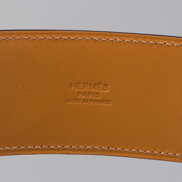 A belt by Hermès "Collier de Chien".