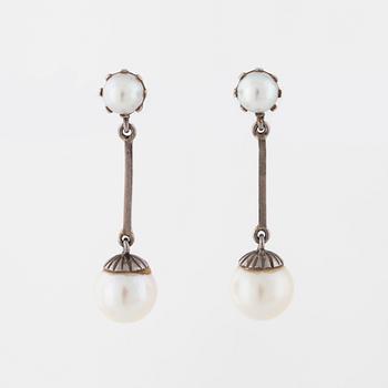 A pair of cultured pearl earrings.