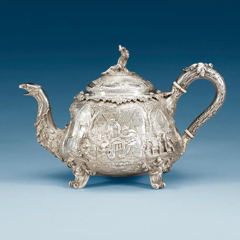 An English 19th century parcel-gilt tea-pot, marks of John Samuel Hunt, London 1849.