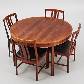 Bertil Fridhagen, a rosewood-veneered dining table with four chairs, BOdsfors, Sweden, 1960's.