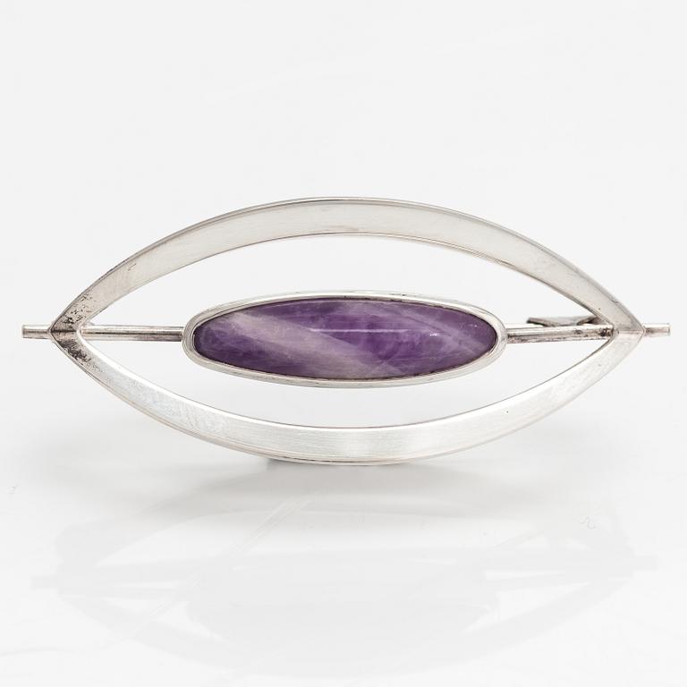 Elis Kauppi, A silver brooch/pendant with an amethyst. Kupittaan kulta, Turku 1961.