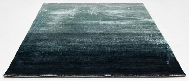 A Designers Guild carpet 'Capisoli teal', ca 205 x 300 cm.