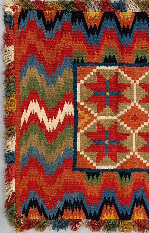 A carriage cushion, double-interlocked tapestry, ca 109,5 x 46 cm, Scania, Sweden.