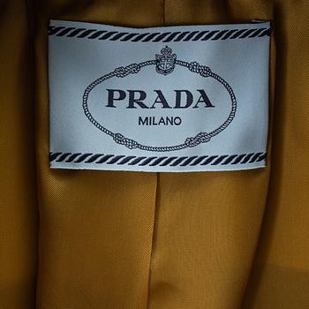 Prada, an olive green scuba jacket.