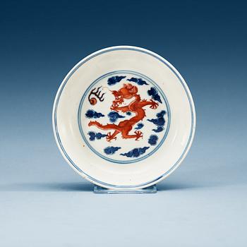 1524. A blue and white enamelled dragon dish, Qing dynasty with hall mark.