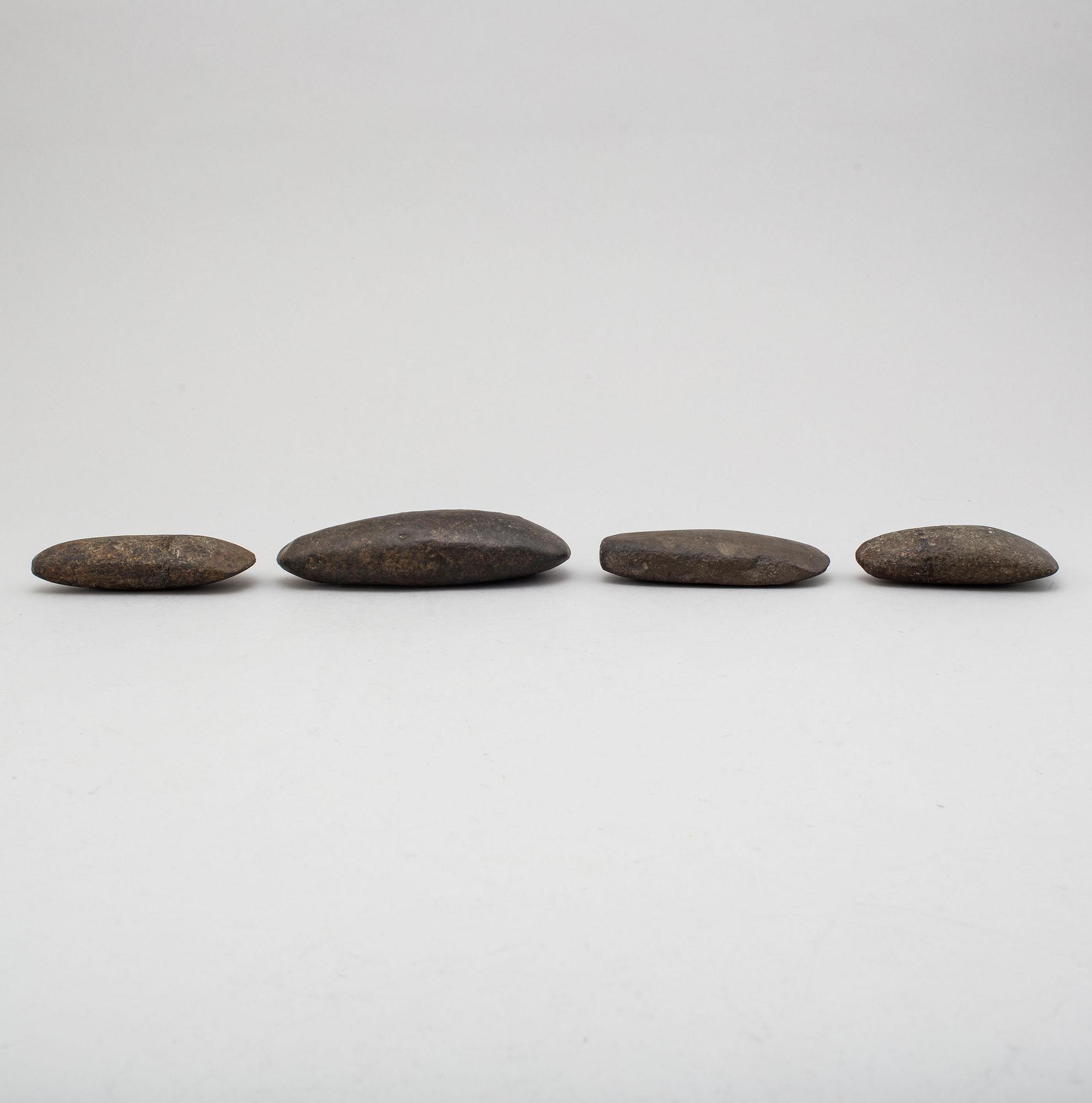 Four neolithic stone axes.