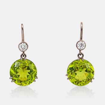 562. A pair of peridot and brilliant-cut diamond earrings.