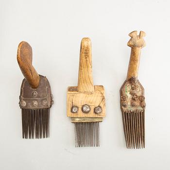 A set of 3 Persian carpet weavers combs and a wood printing block, 20th Century.