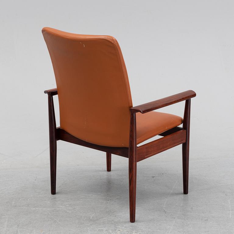 Finn Juhl, a rosewood easy chair, from Cado, Denmark, 1960's/70's.