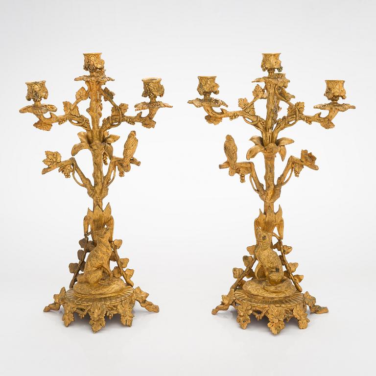 A pair of gilt brass candelabra from the latter half of the 19th century.