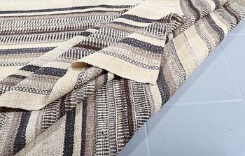 A FLATWEAVE RUG, 338 x 240 cm.