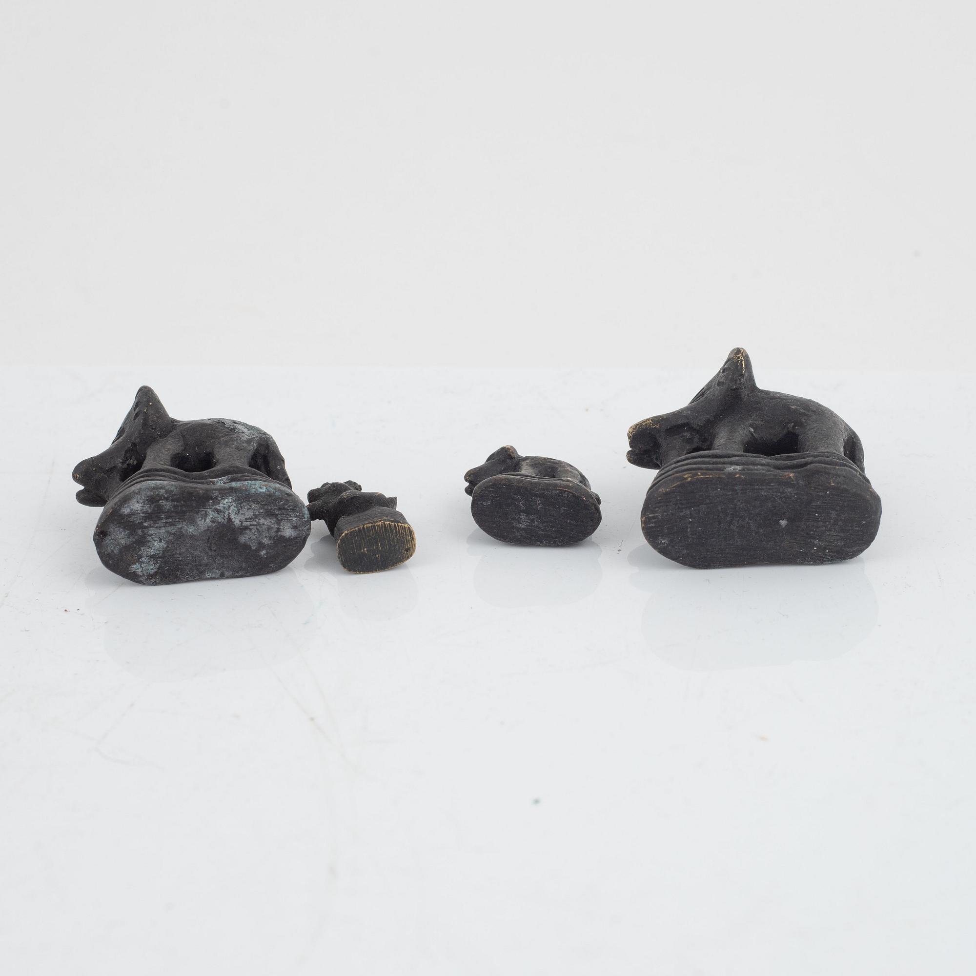 Nine bronze opium weights, Burma, 19th/20th century.