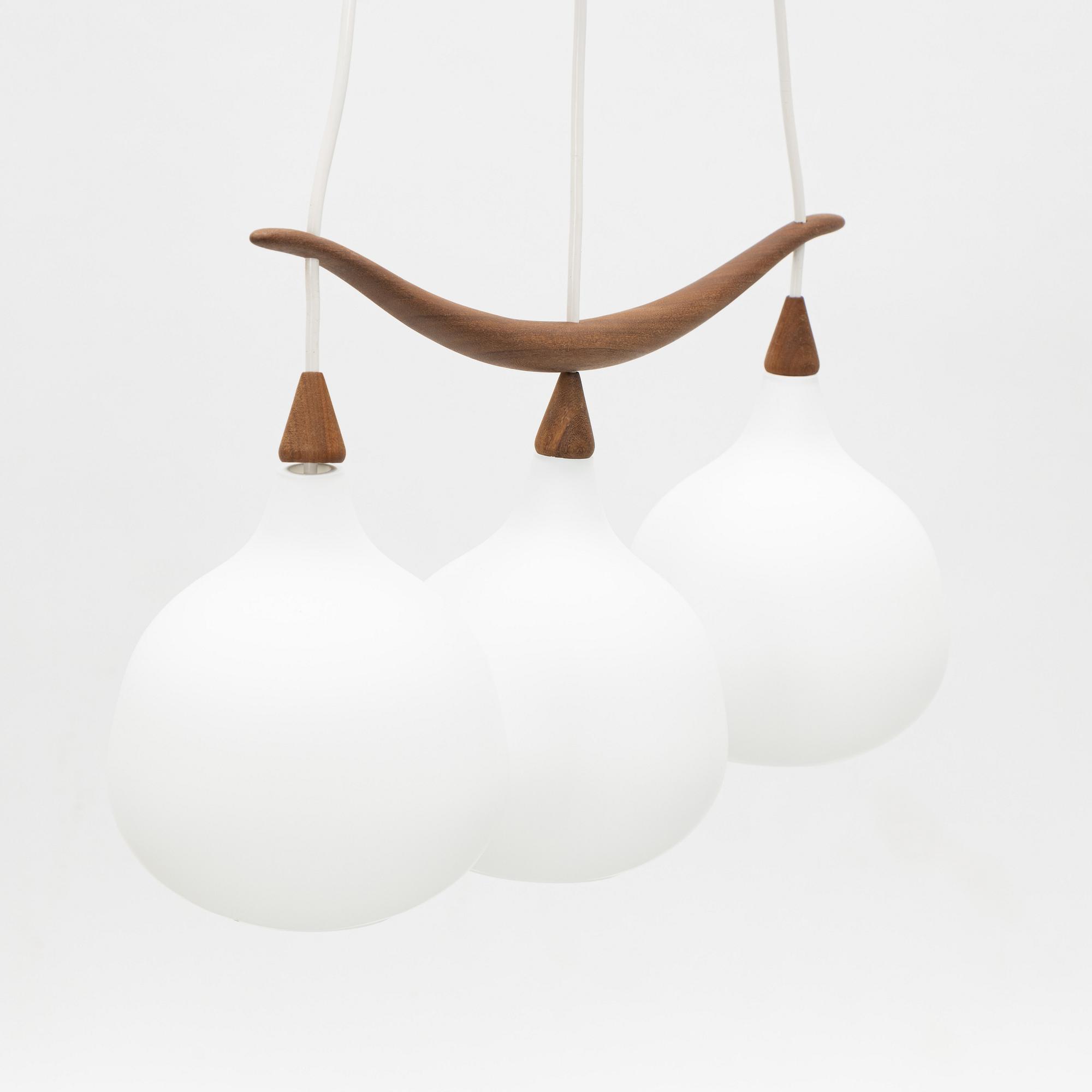 Uno & Östen Kristiansson, a 'Bananen' teak and glass three-light ceiling lamp, Luxus, Vittsjö.