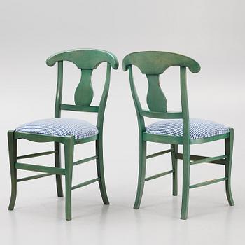 A dining table with eight chairs, Grange, France, late 20th century.