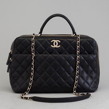 A black leather bag by Chanel 2014-2015.