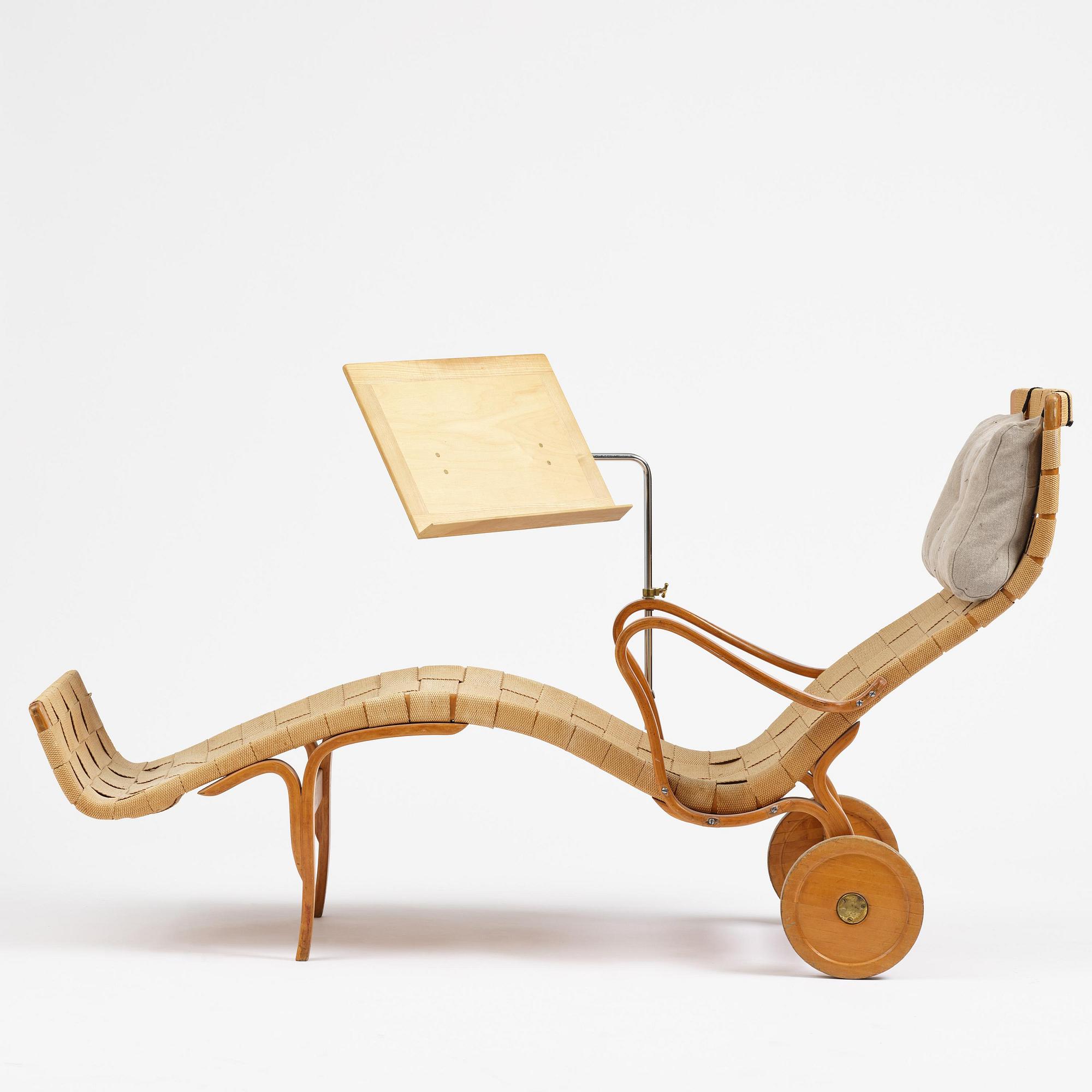 Bruno Mathsson, a lounge chair with wheels, Firma Karl Mathsson, Värnamo, 1940s, with reading table from 1972.
