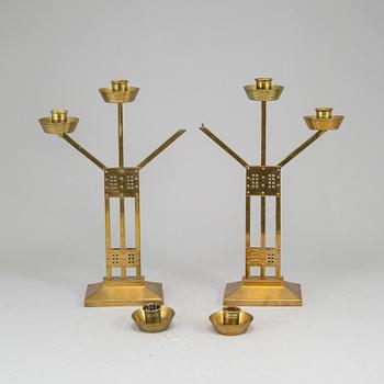 A pair of Art nouveau brass candelabra, early 20th Century.